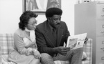 Ivory Moore Reading Newspaper by East Texas State University