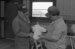 Student Examining Chicken by East Texas State University
