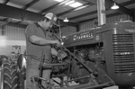 Person with Farmall Tractor by East Texas State University