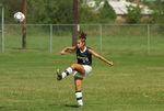 Soccer Player Kicks the Ball by Texas A&M University-Commerce