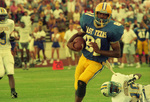 Raymond McGuire Running with Ball by East Texas State University