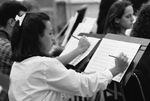 Student Notating Sheet Music by Texas A&M University-Commerce