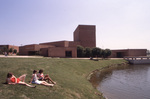 Students Sitting by Gee Lake by East Texas State University