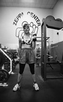 Student Lifting Dumbells by Texas A&M University-Commerce