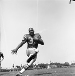 "King" Arthur Joe James with Football by East Texas State University