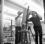 Art Students Peeking Through Art Building Windows by East Texas State College